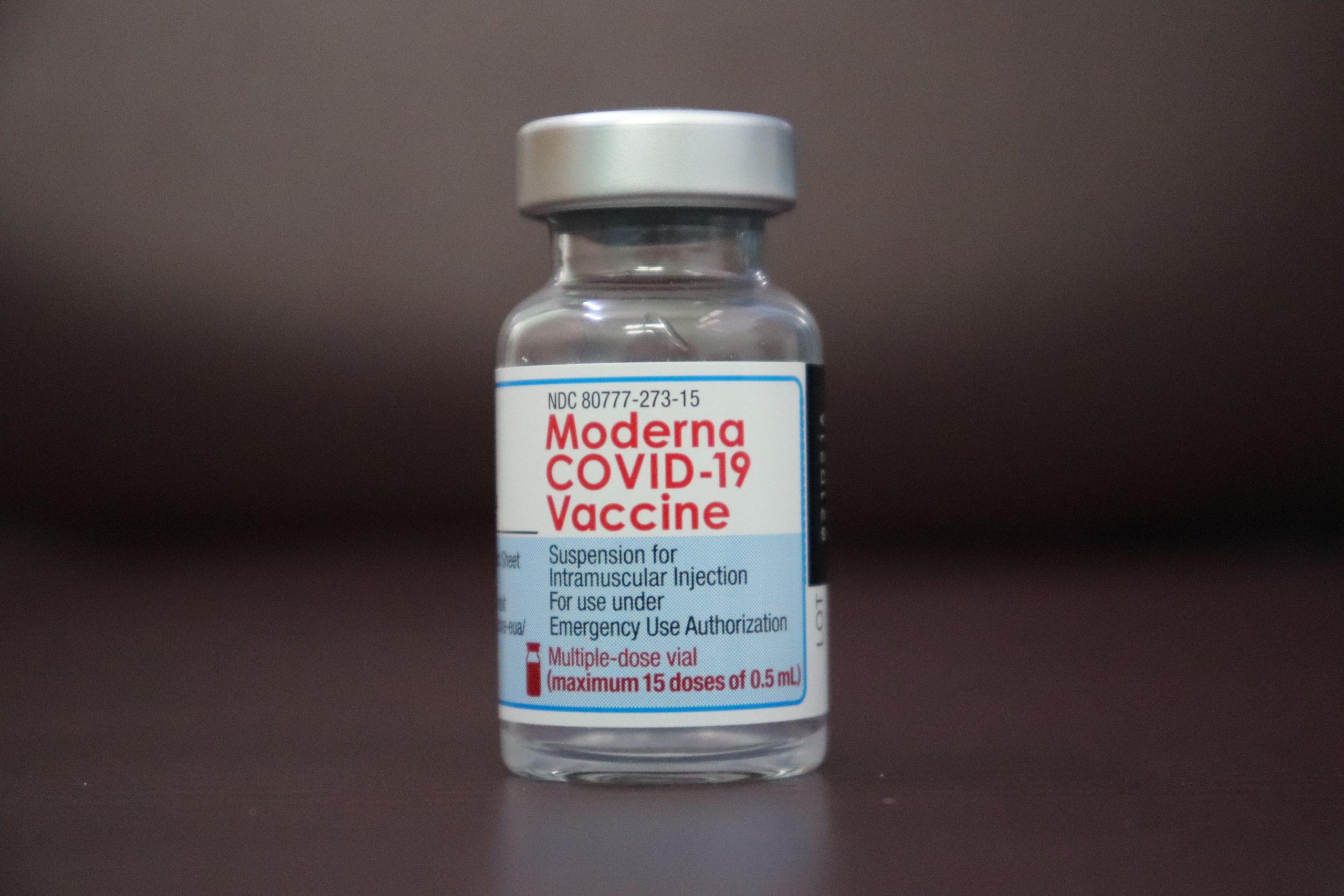 Close-up of a Moderna COVID-19 vaccine vial for emergency use authorization.